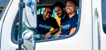 Roadway's movers smiling in their truck